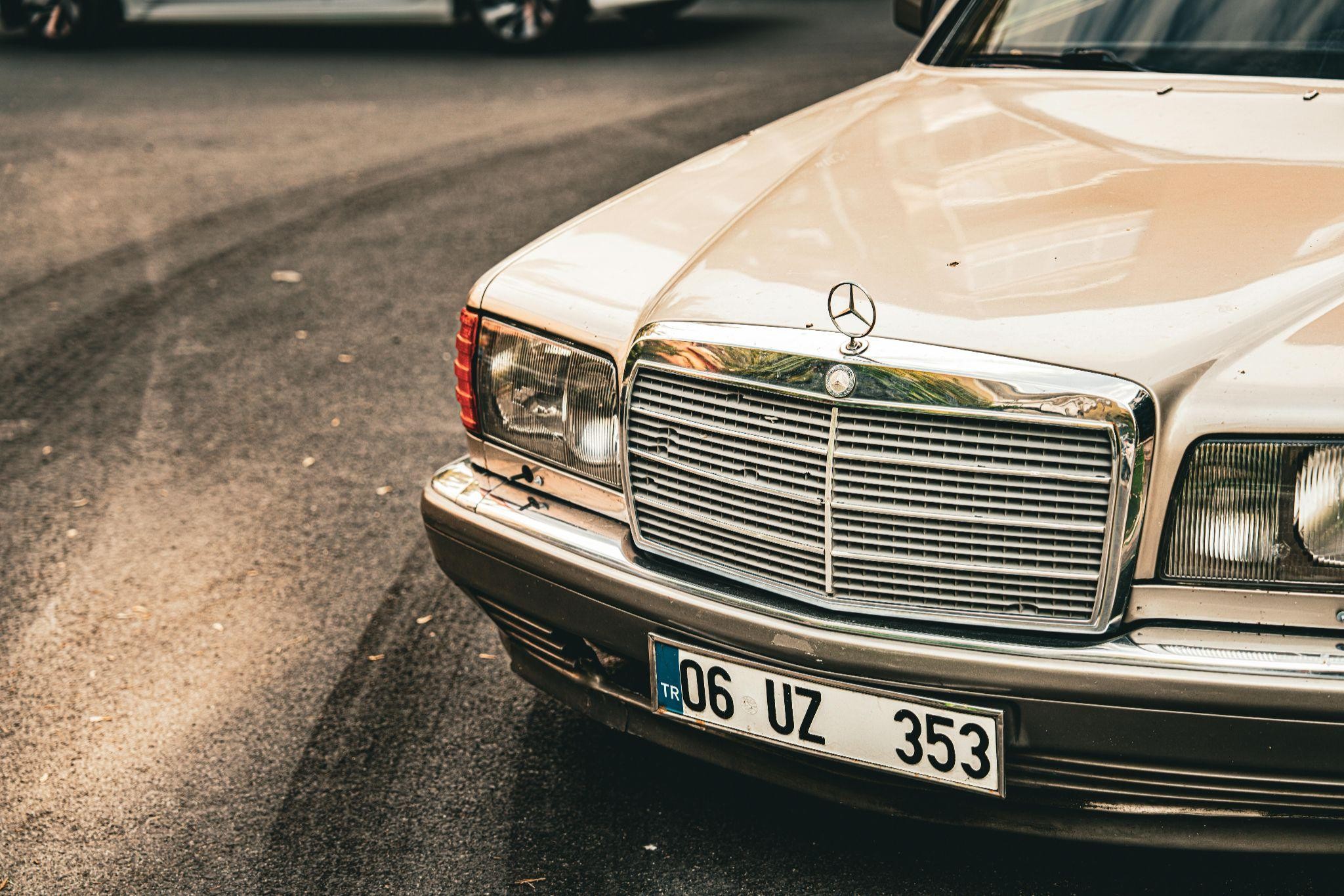 A close up image of an old model of mercedes